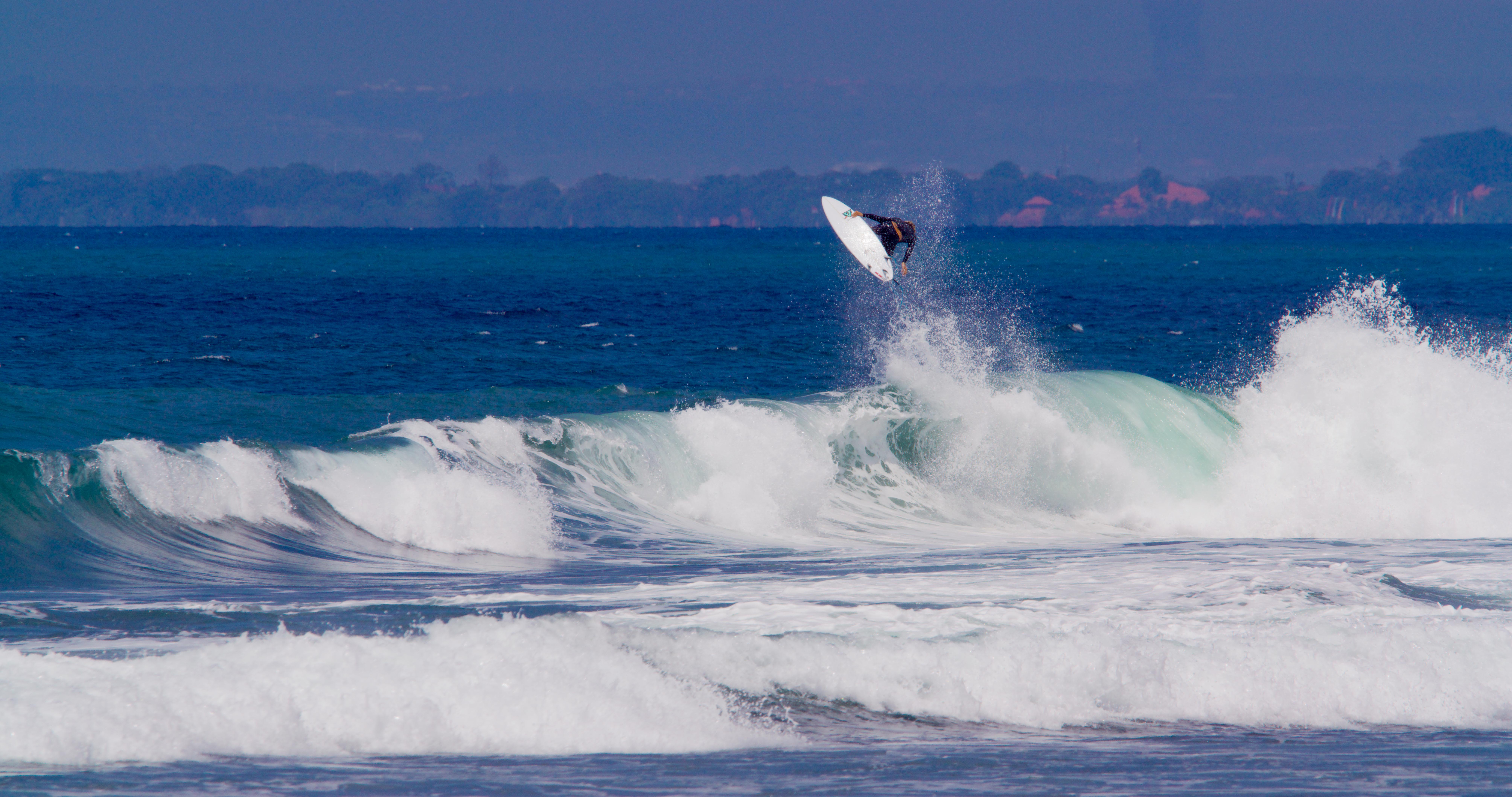 Eric Geiselman professional surfer Bali Indonesia surf photography action shot