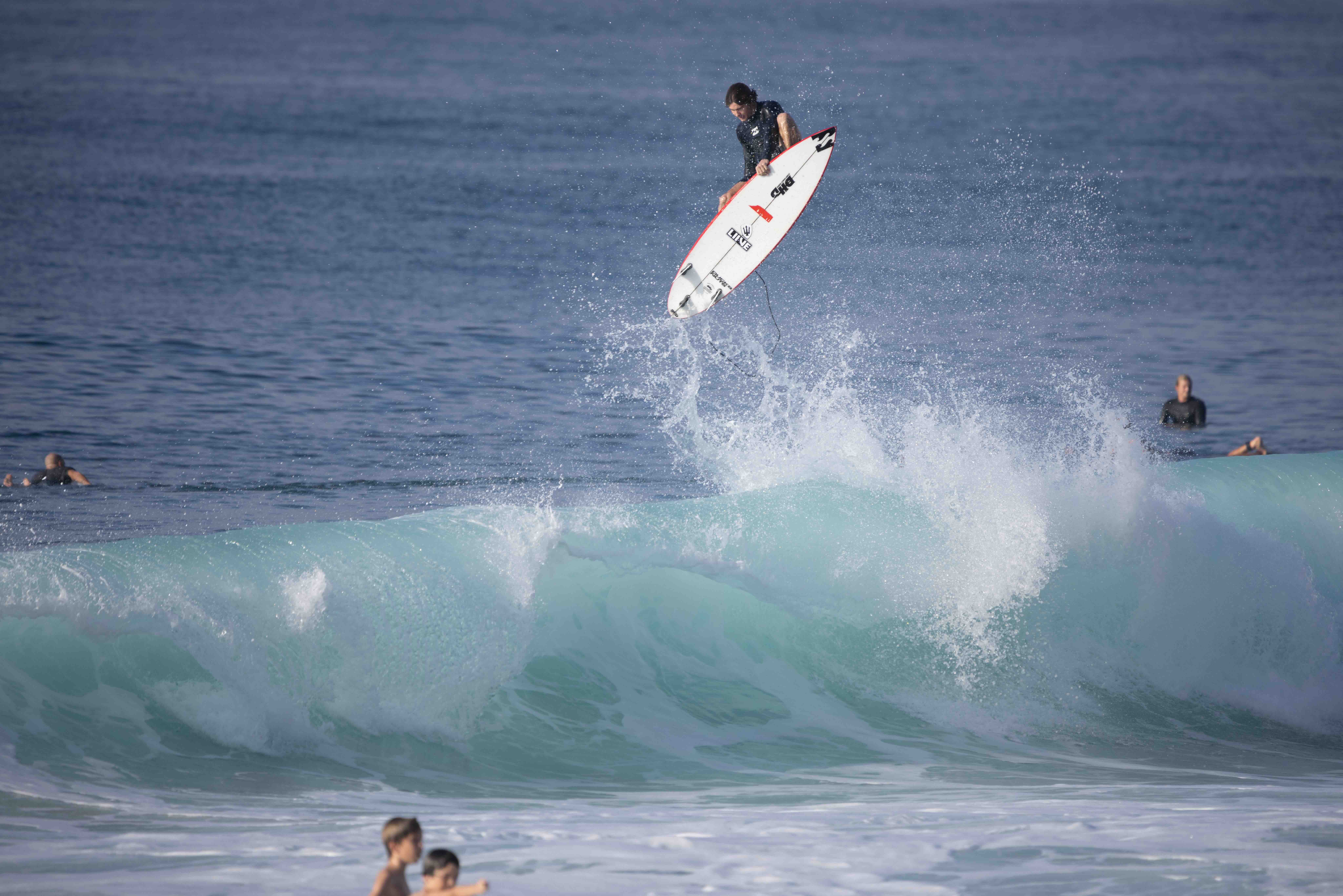Liam Pipeline tube ride surf photography Hawaii barrel professional surfer covered up