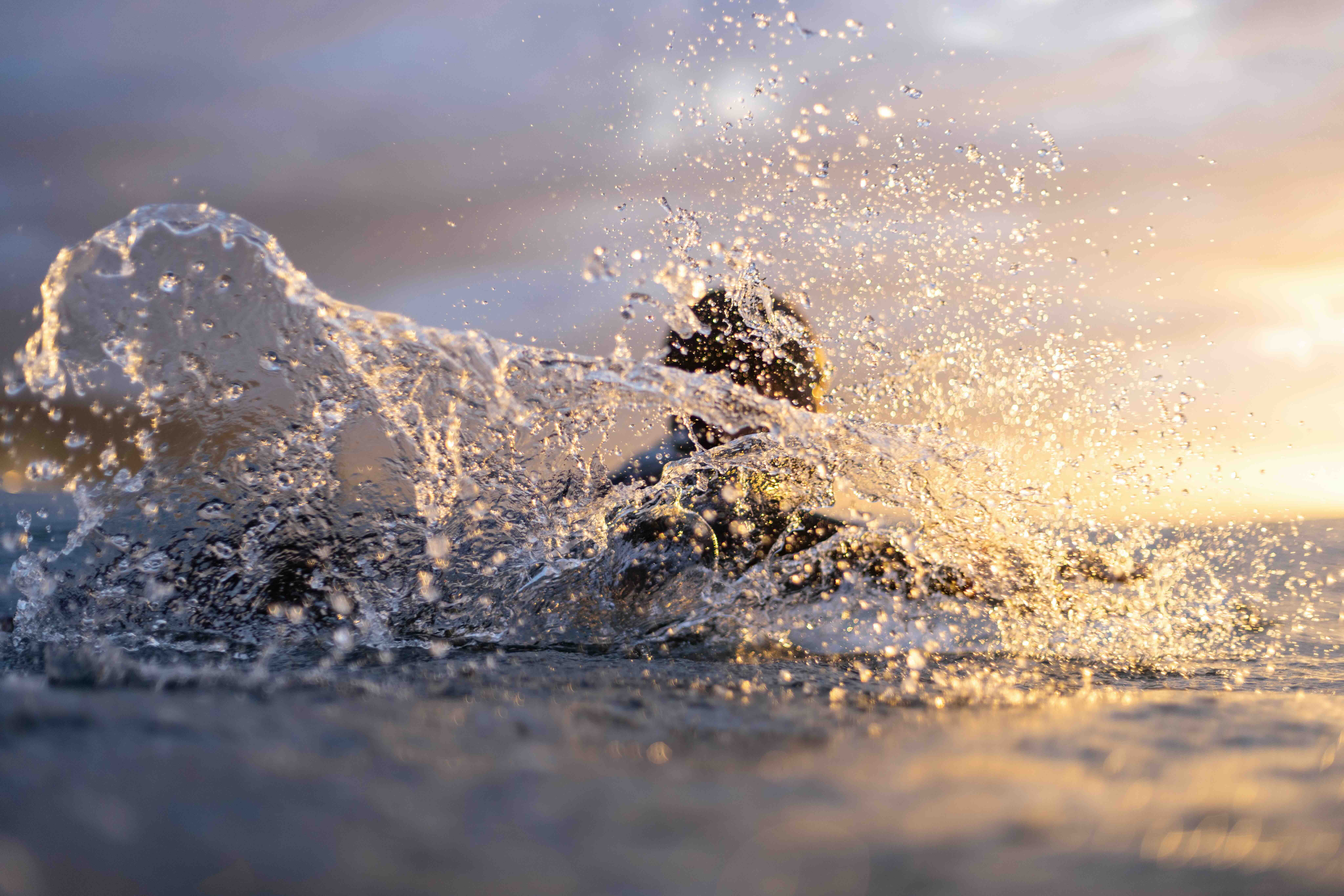 Sunset water surf photography golden hour ocean waves dramatic light